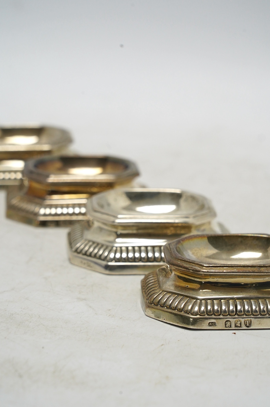 A set of three late Victorian Brittania standard silver trencher salts, Arthur Carter? London, 1894, 79mm and a similar Portuguese? salt. Condition - fair